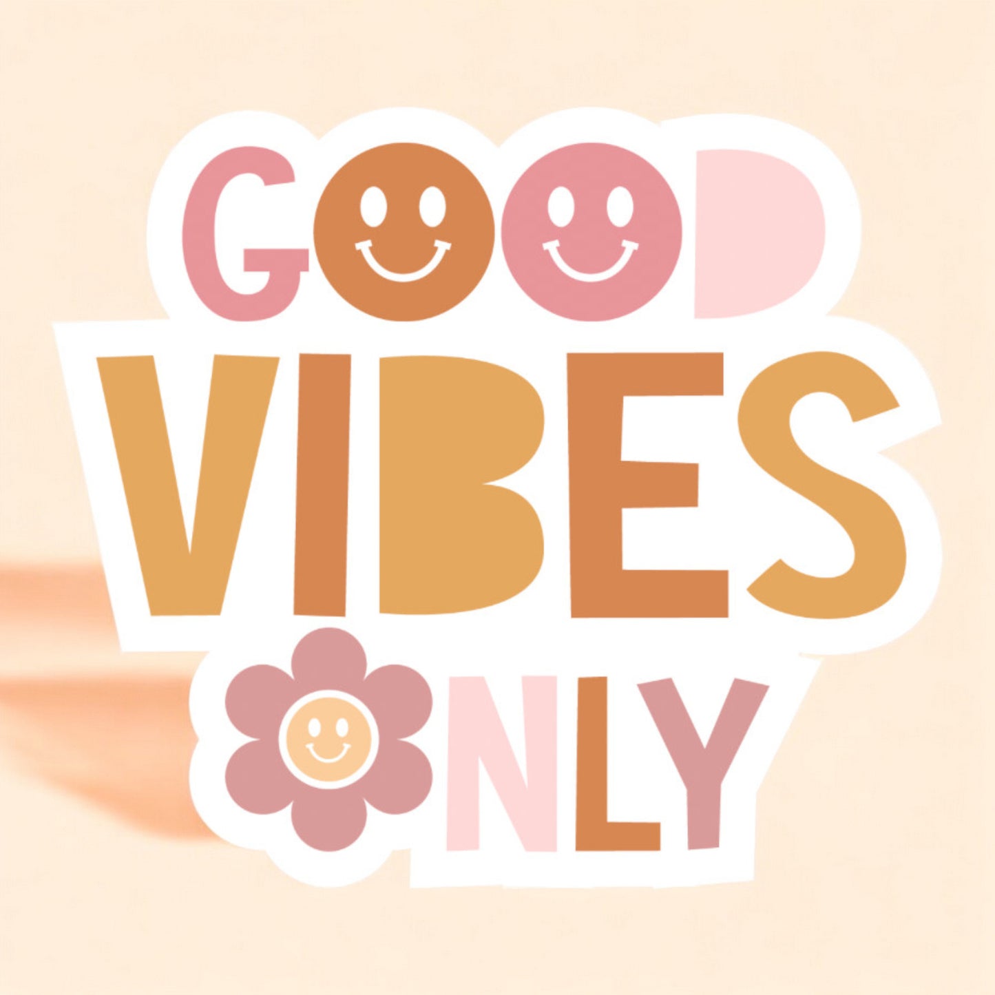a white background sticker that reads good vibes only with smiley faces for the o's in light pink, peach, orange, and mauve pink
