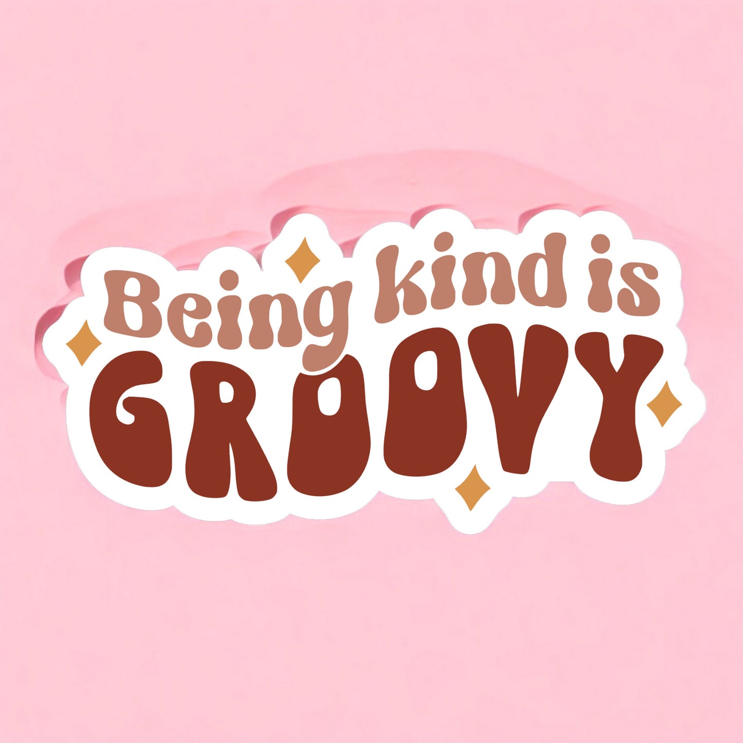a sticker that reads being kind is groovy in taupe brown and brown with mustard yellow stars