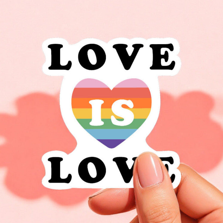 a sticker that reads love is love with a rainbow heart in the center