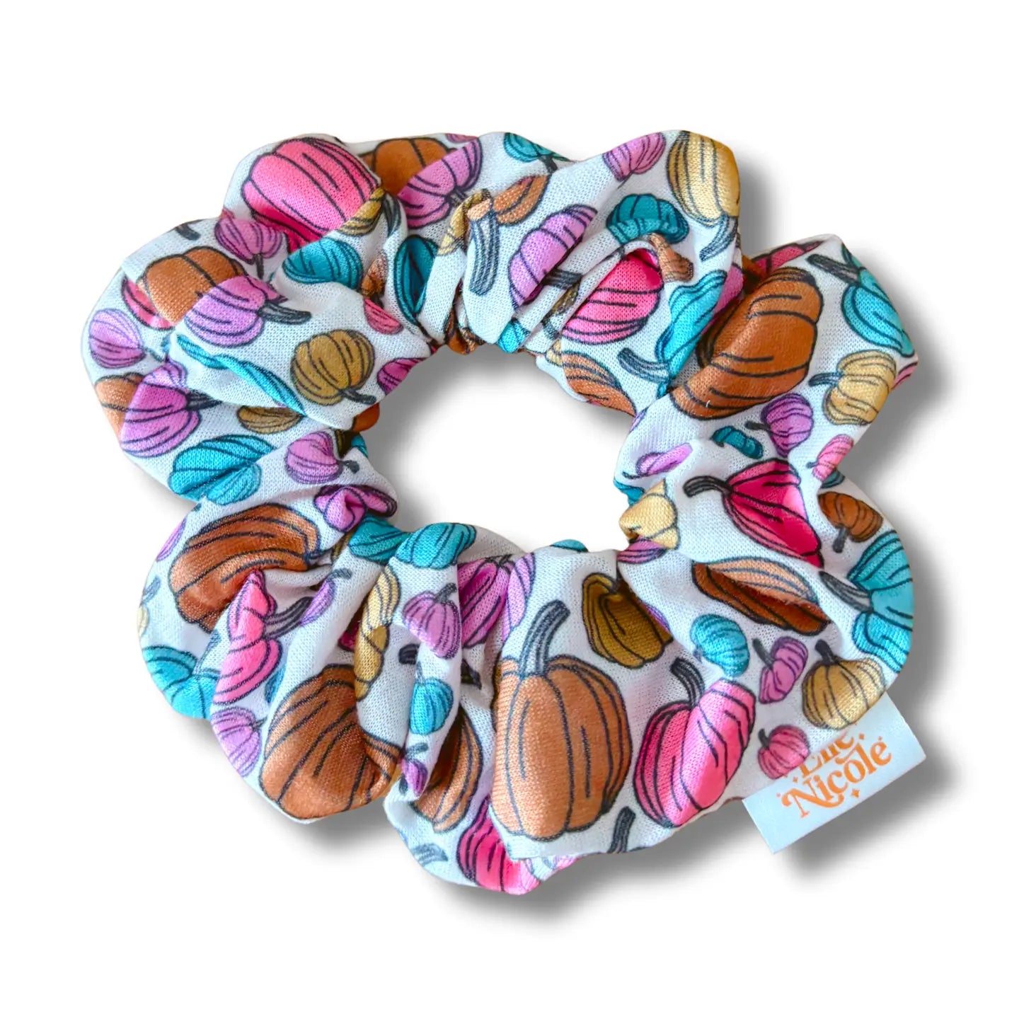 Colorful scrunchie with pumpkins on a white background