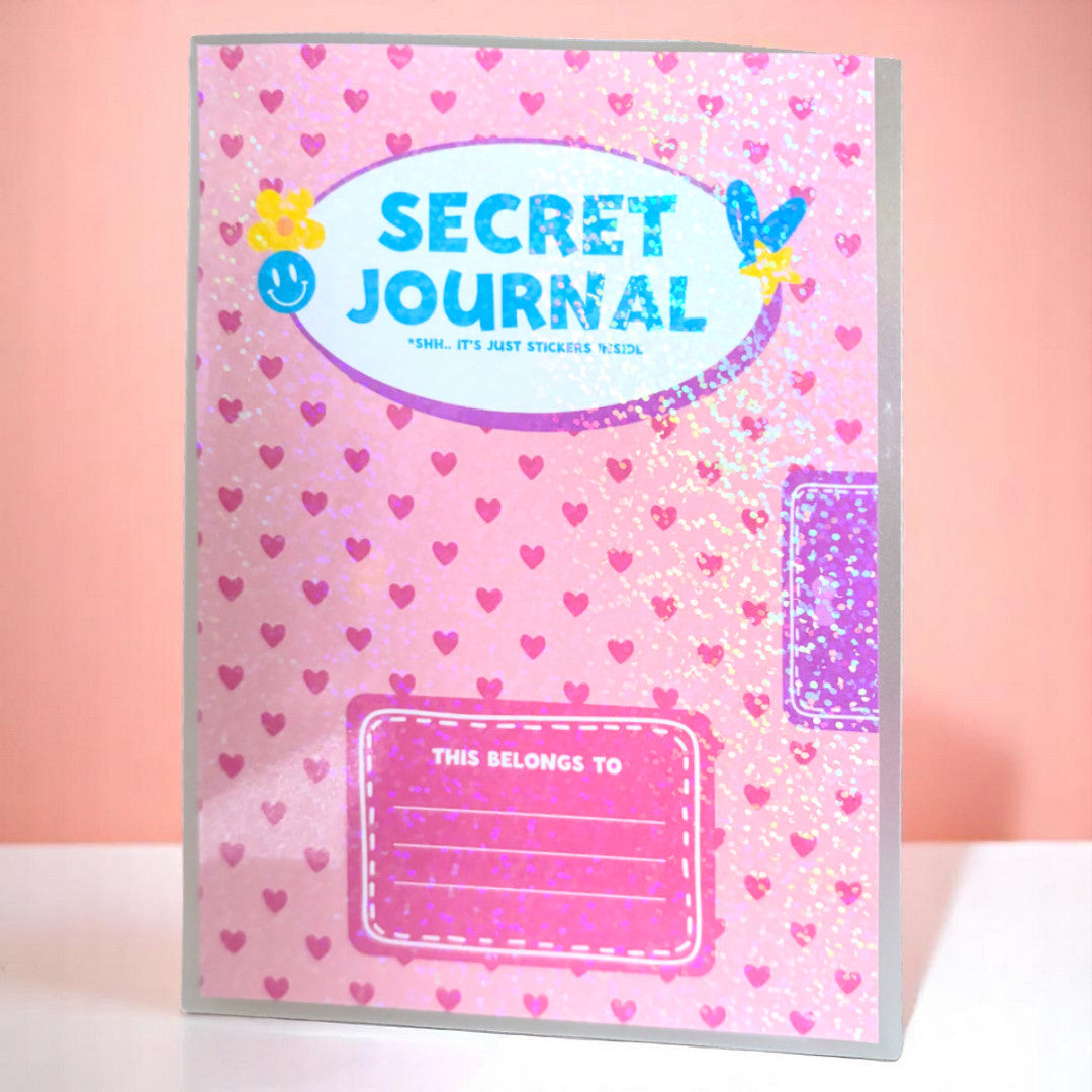 a sticker book that looks like a journal, covered in holographic overlay, with the words 'secret journal' and a spot that reads 'this belongs to' with lines to write your name. the entire background is pink hearts.