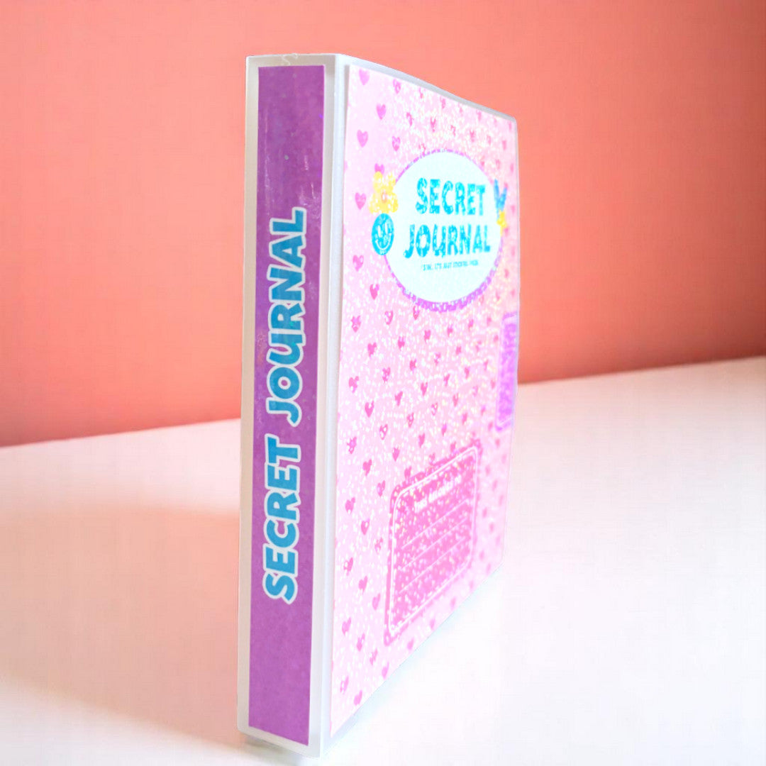 a sticker book that looks like a journal, covered in holographic overlay, with the words 'secret journal' and a spot that reads 'this belongs to' with lines to write your name. the entire background is pink hearts.