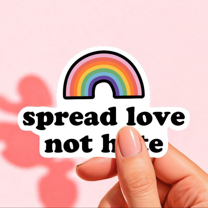 a pride sticker that reads spread love not hate with a rainbow