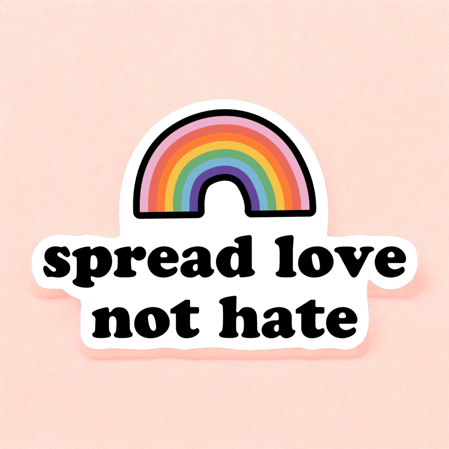 a pride sticker that reads spread love not hate with a rainbow