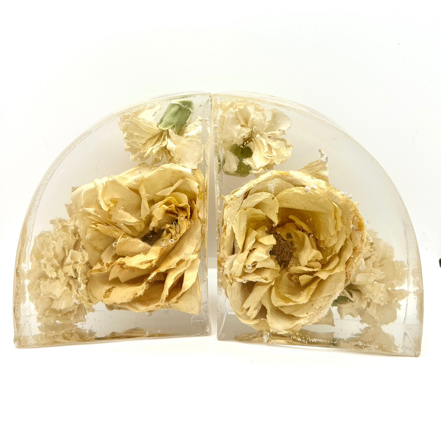 Custom resin bookend set made with white flowers included roses and carnations. A flower preservation option that is useful home decor forever.
