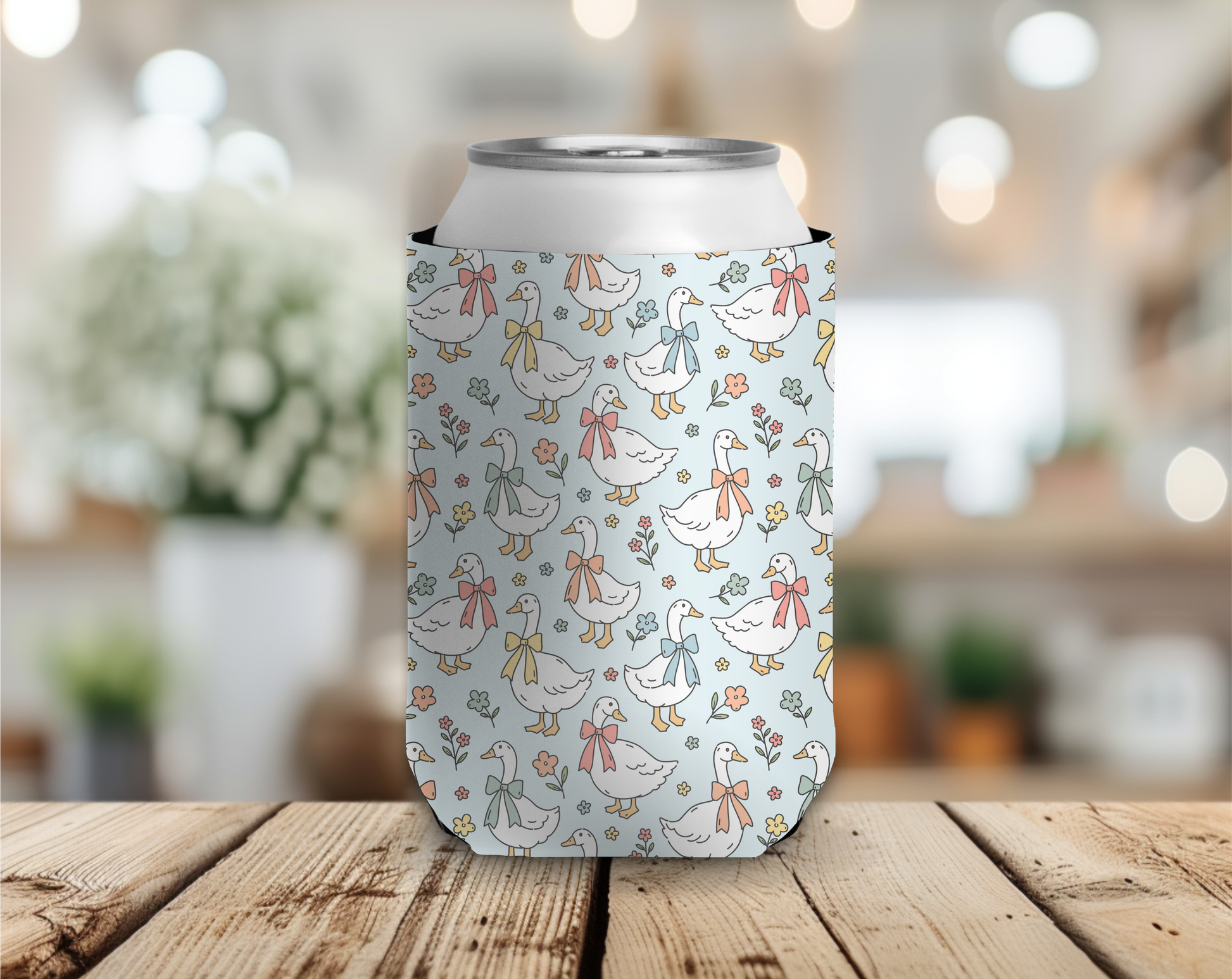 Can cooler with duck pattern on a wooden table