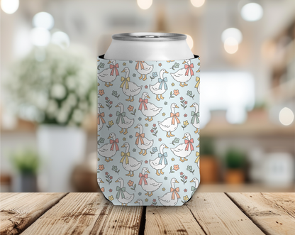 Can cooler with duck pattern on a wooden table