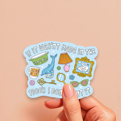 Sticker with vintage-themed illustrations held by a hand on a beige background