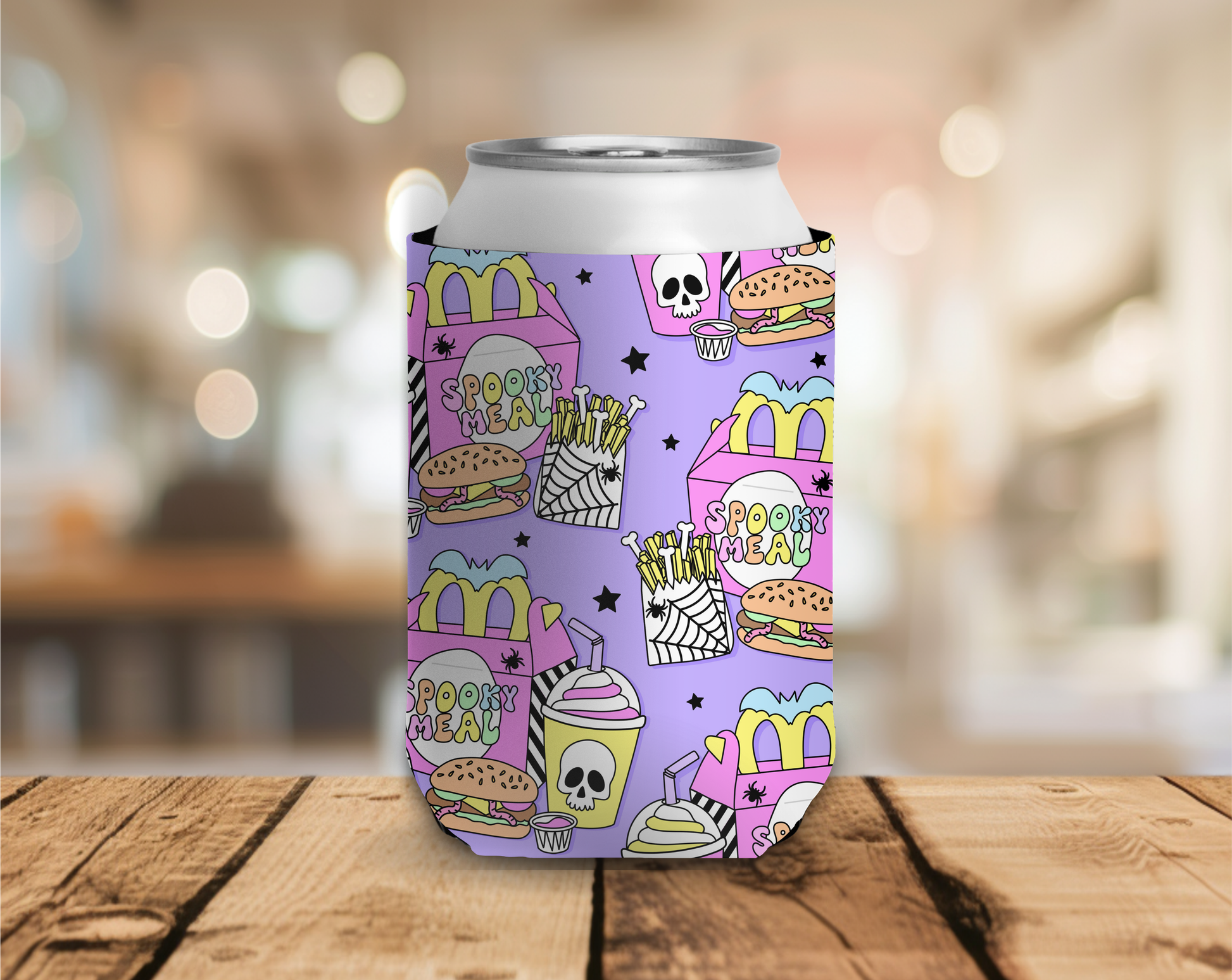 Colorful can cooler with fast food-themed design on a wooden surface.