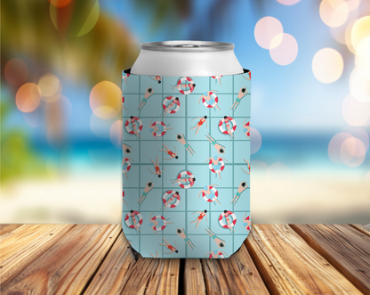 Can cooler with beach-themed design on a wooden surface with a blurred beach background