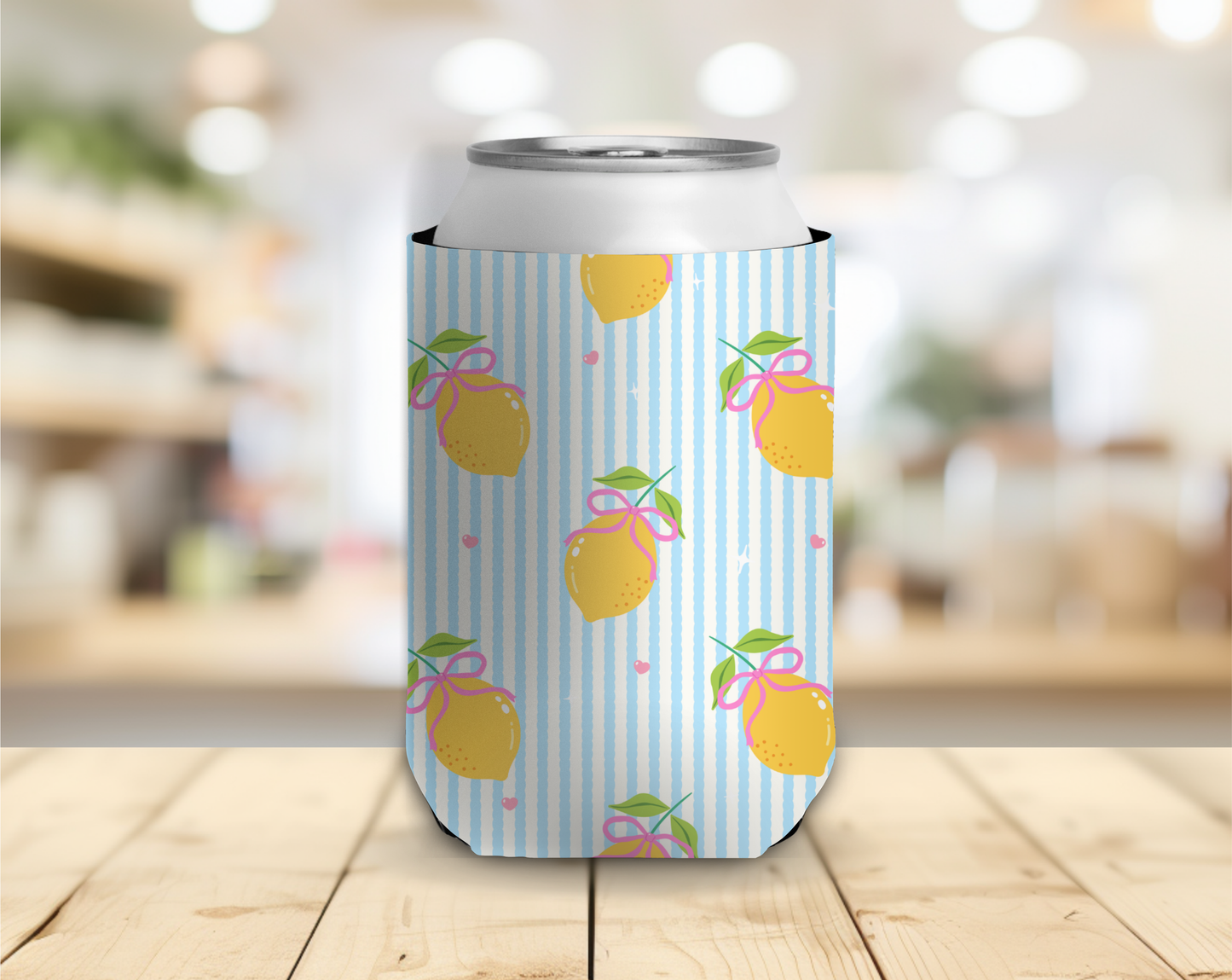 Can cooler with lemon design on a wooden surface