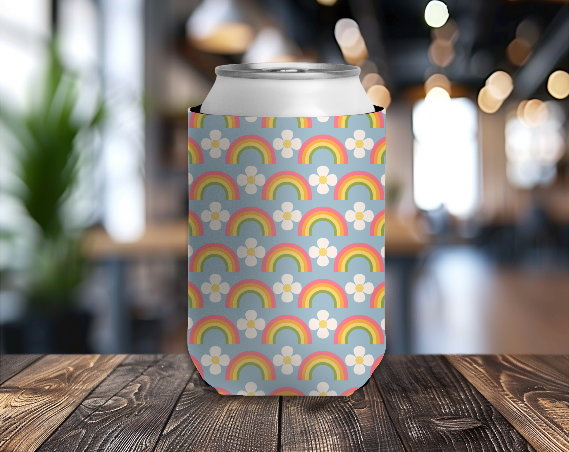 Can with a colorful rainbow and flower pattern on a wooden table.