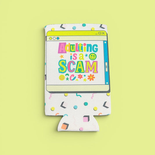 Koozie with 'Adulting is a Scam' text on a yellow background