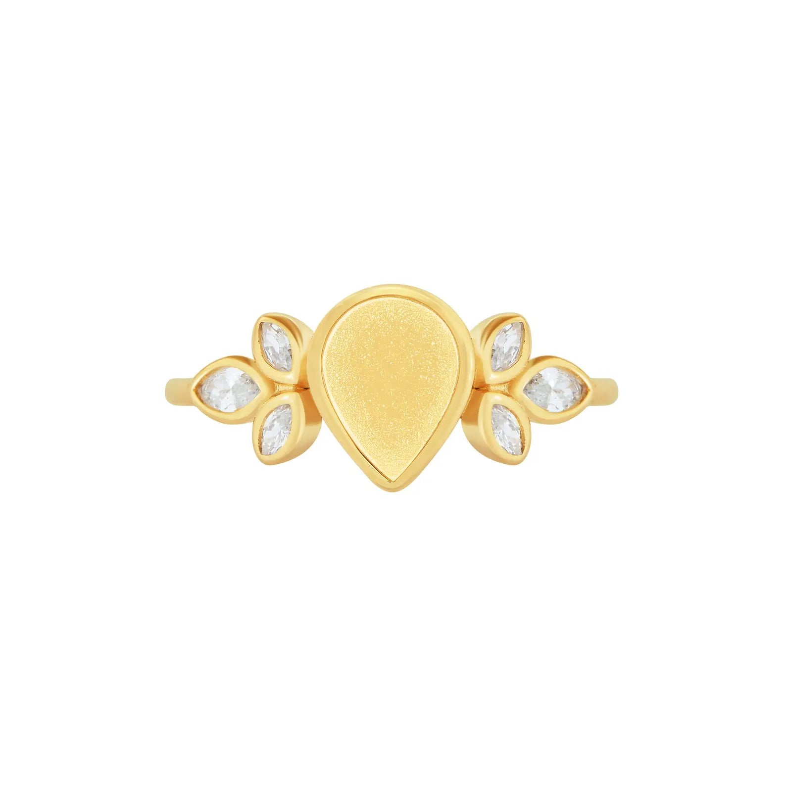 Gold ring with teardrop design and clear stones on a white background