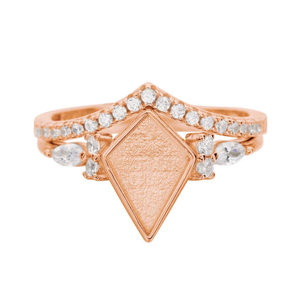 Rose gold ring with diamond-shaped center and small diamonds on a white background