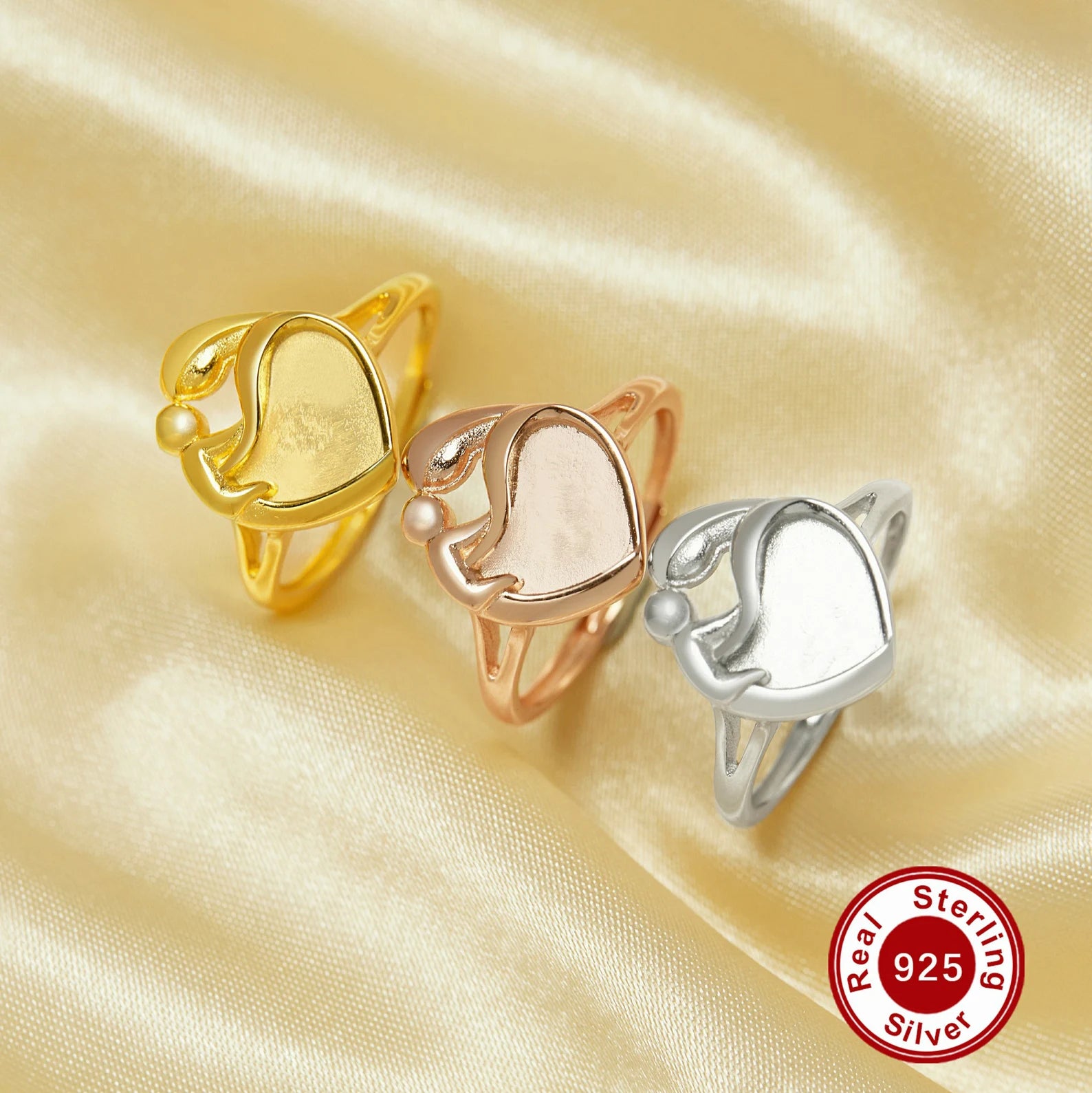 Three gold, rose gold, and silver rings on a satin background with a 'Real Sterling Silver' 925 stamp.