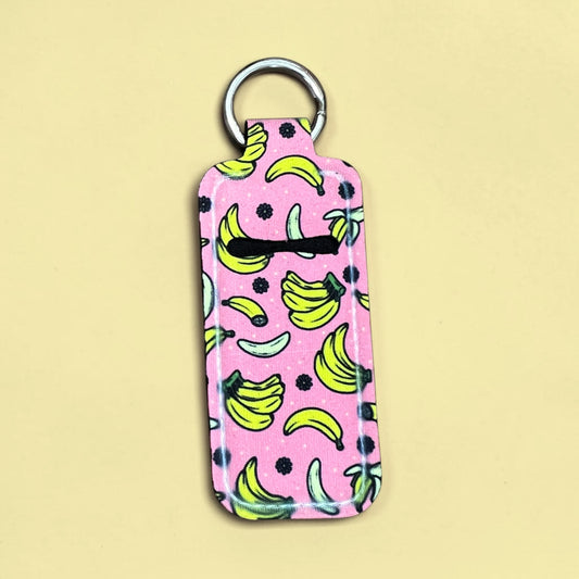 Keychain with banana pattern on a pink background