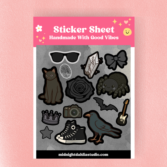 Sticker sheet with various black illustrations on a gray background, labeled 'Handmade With Good Vibes' by midnightdahliastudio.com.