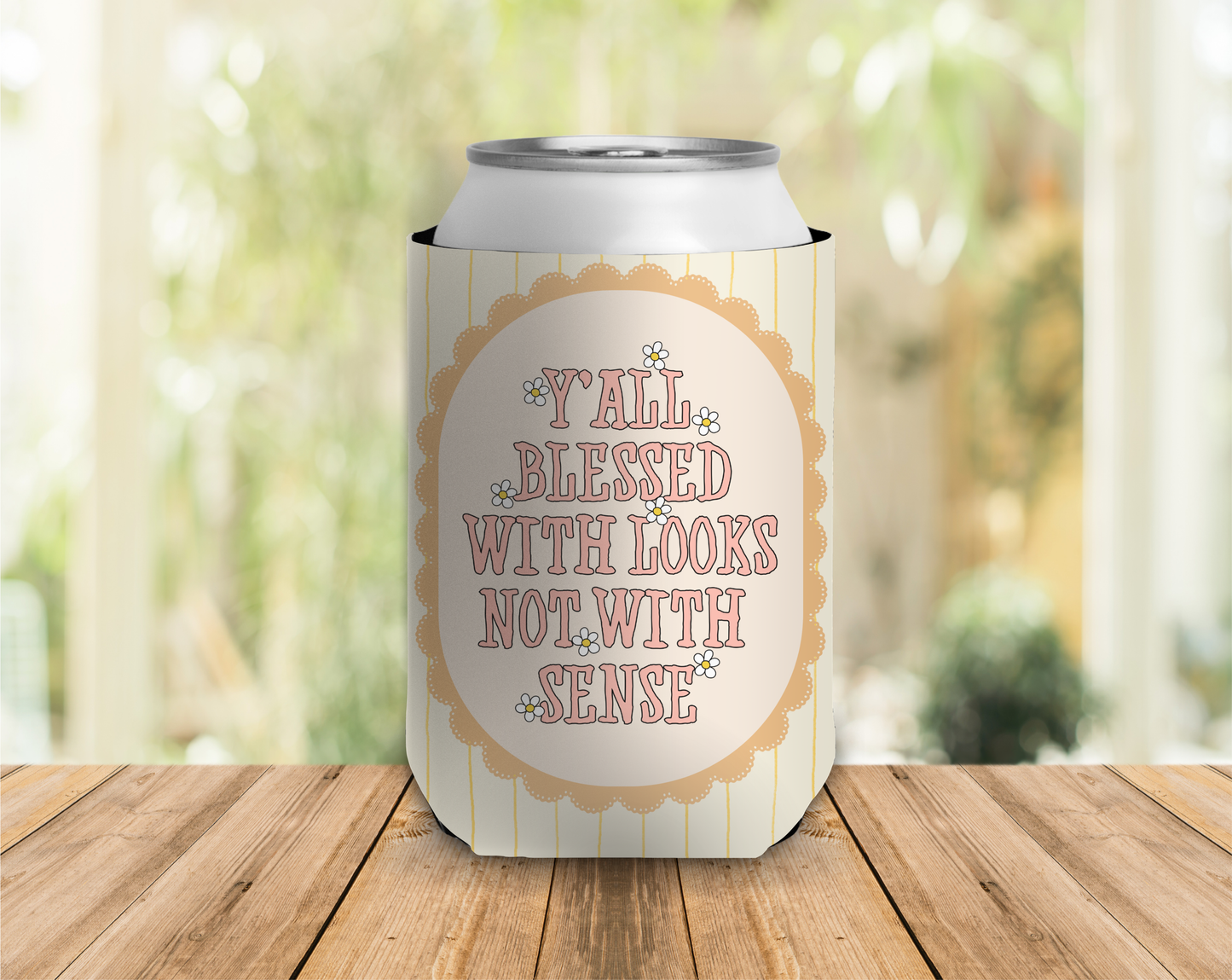 a can cooler that reads 'yall blessed with looks but not with sense'