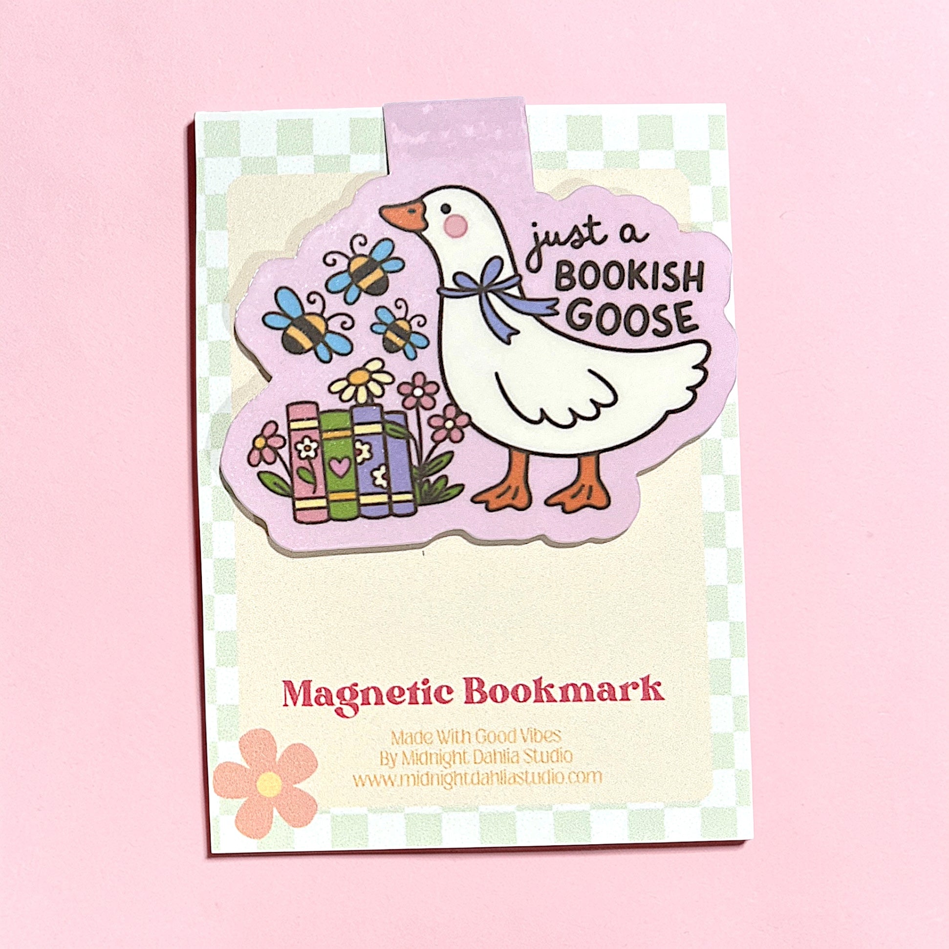 Magnetic bookmark with a goose illustration on a pink background