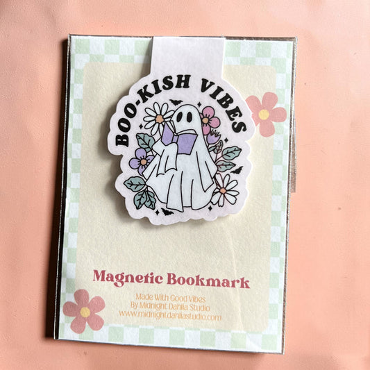 Magnetic bookmark with ghost design and 'Boo-kish Vibes' text on a checkered background