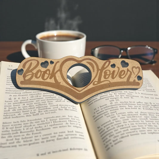 Wooden 'Book Lover' glasses holder on an open book with a cup of coffee and glasses in the background.