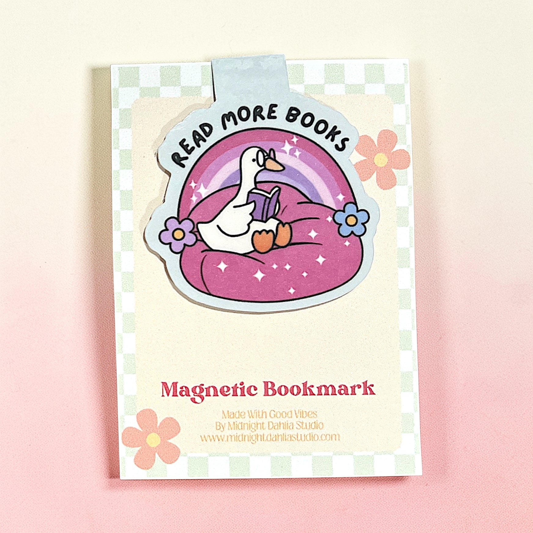 Magnetic bookmark with cartoon duck design on a checkered background