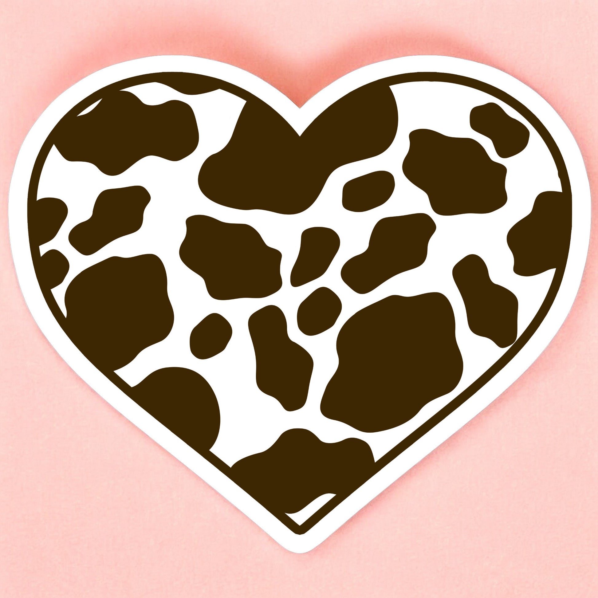 a heart shaped sticker with a brown cow print pattern