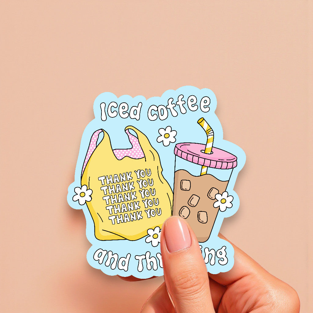 Sticker with iced coffee design and 'Thank you' text held by a hand on a beige background