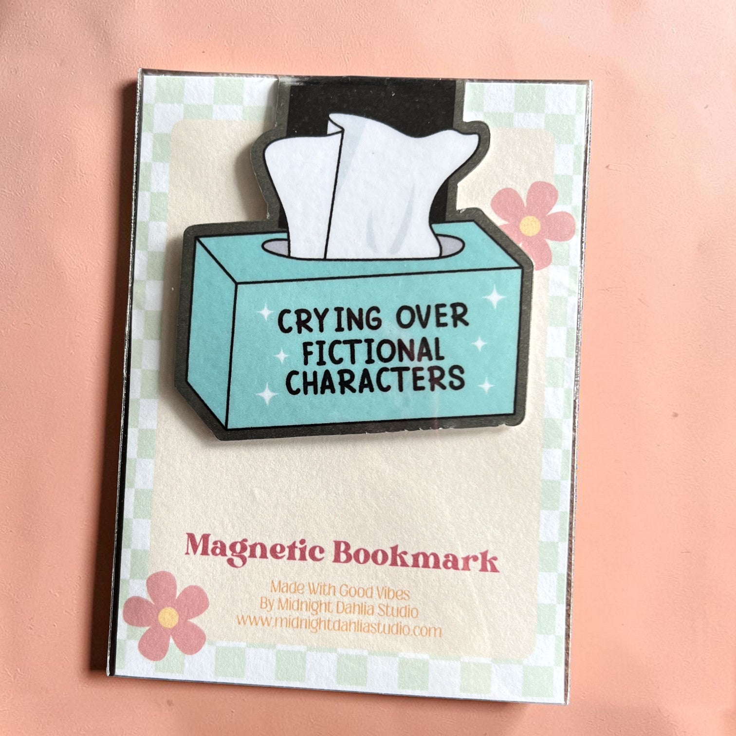 Magnetic bookmark with tissue box design and text 'Crying Over Fictional Characters' on a checkered background.