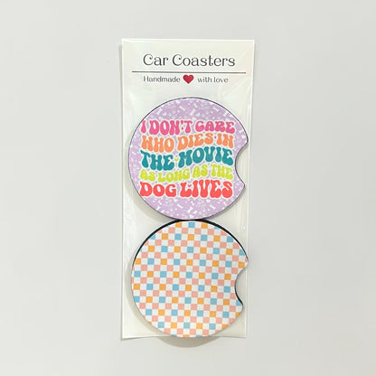 Two car coasters with humorous text design on a white background