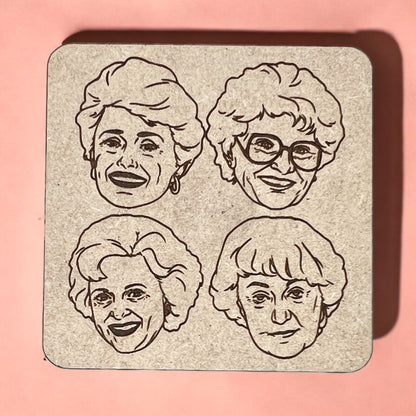 A square magnet with a humorous quote printed on it, placed against a pink background.
