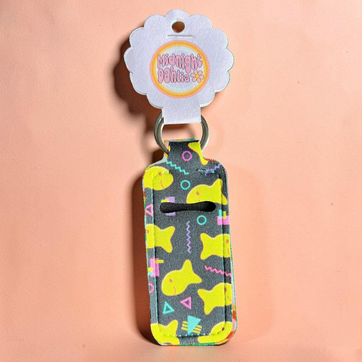 Keychain with shark pattern on a pink background