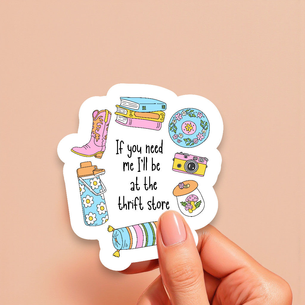 Sticker with illustrations and text held by a hand on a beige background