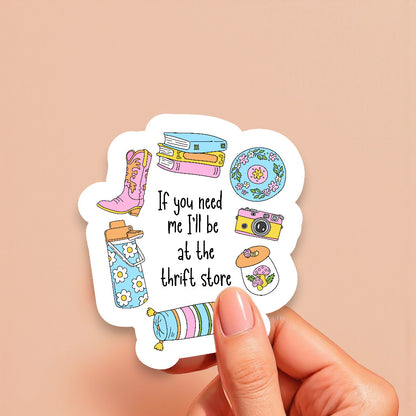 Sticker with illustrations and text held by a hand on a beige background