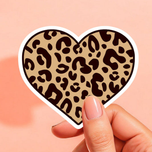 a heart shaped sticker printed with leopard / cheetah print in brown