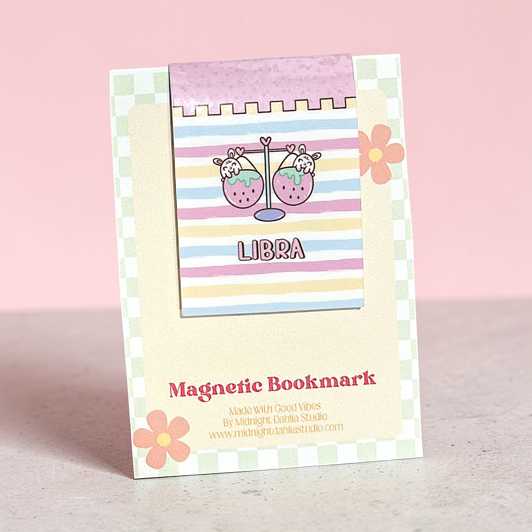 Magnetic bookmark with Libra design on a pink background
