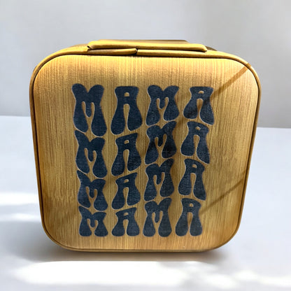 a brown bamboo color jewelry box engraved with black "mama" repeated four times