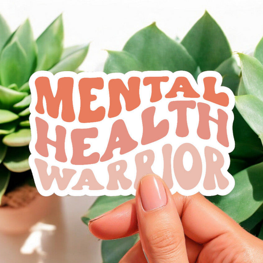 a white sticker that reads mental health warrior