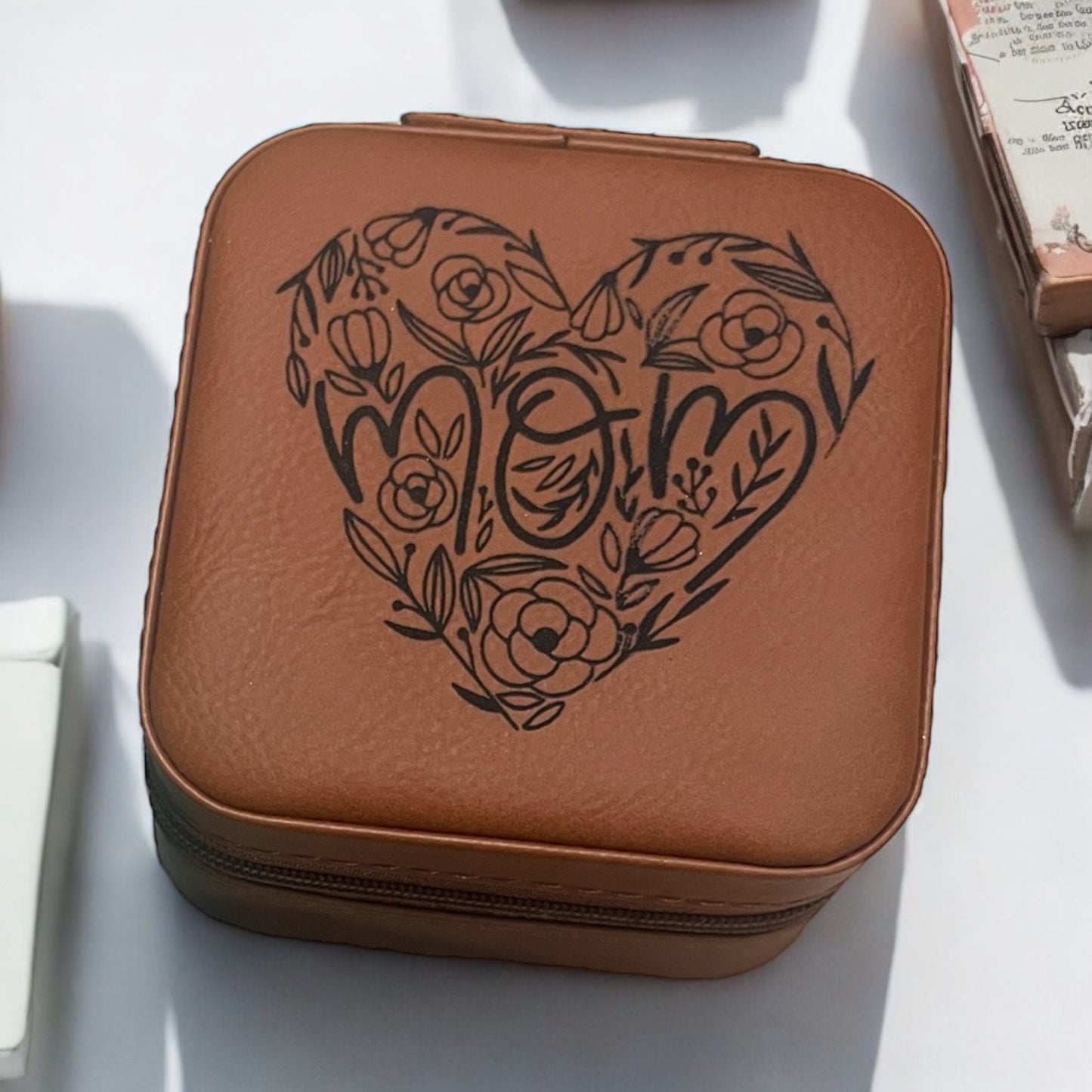 a brown jewelry box engraved with mom in a floral theme heart in black