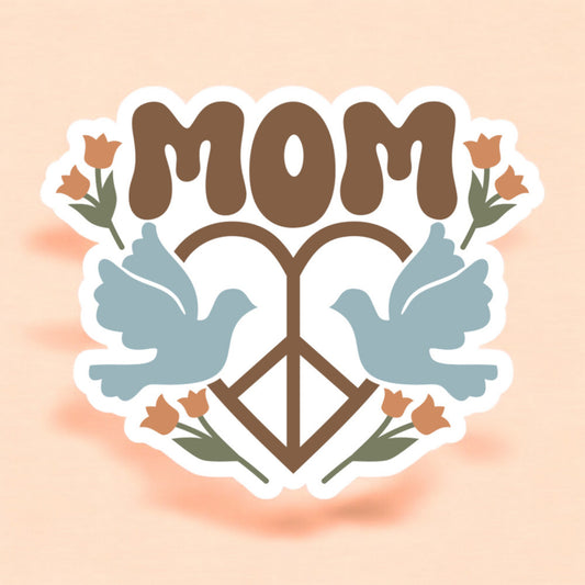 a sticker with the word mom with a heart shaped peace sign with a light blue dove on either side
