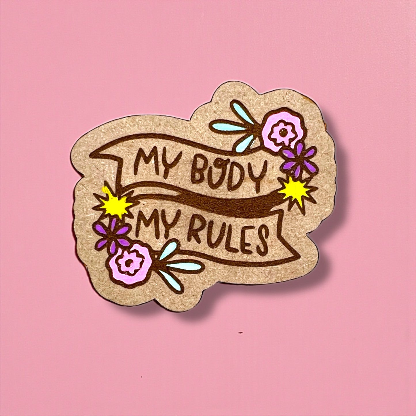 Sticker with 'My Body My Rules' text on a pink background