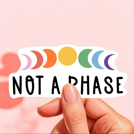 a sticker that reads not a phase with the phases of the moon in rainbow colors