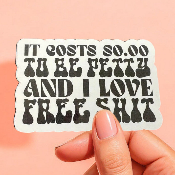 a white sticker that reads it costs $0.00 to be petty and I love free shit in a retro font in black