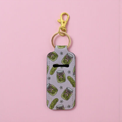 Keychain with green jar pattern on a pink background