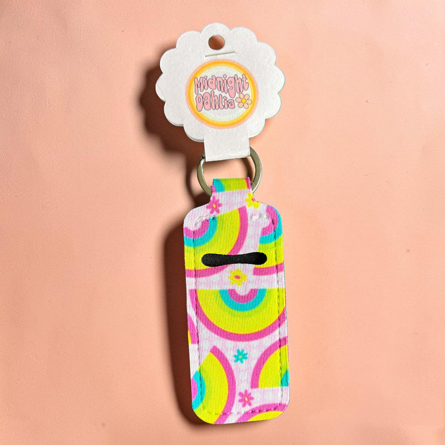Colorful keychain with a pattern on a pink background
