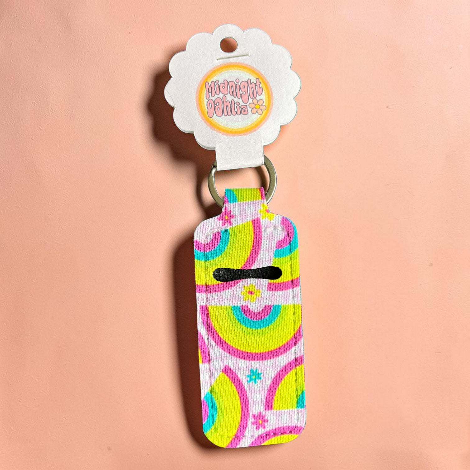 Colorful keychain with a pattern on a pink background