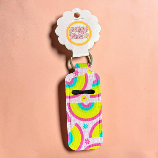 Colorful keychain with a pattern on a pink background