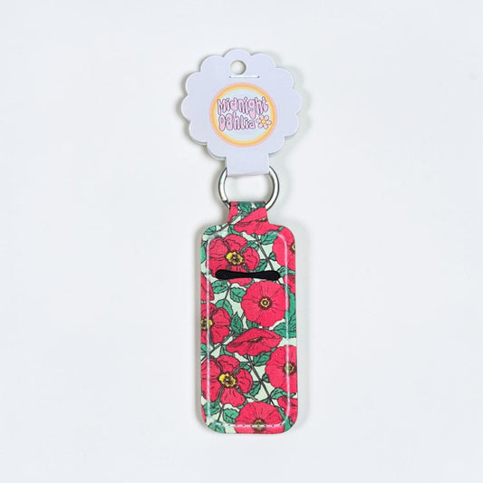 Floral-patterned keychain with a visible brand label on a white background