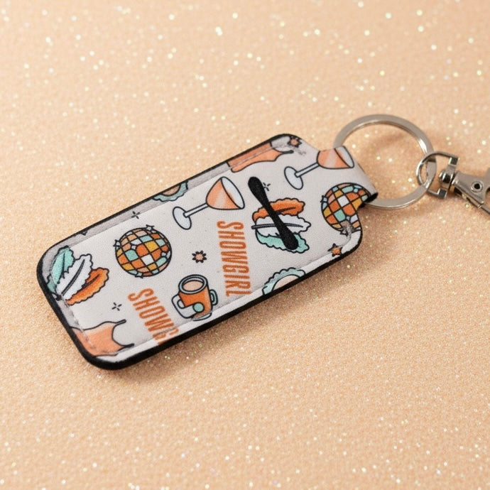 Keychain with a patterned case on a beige background